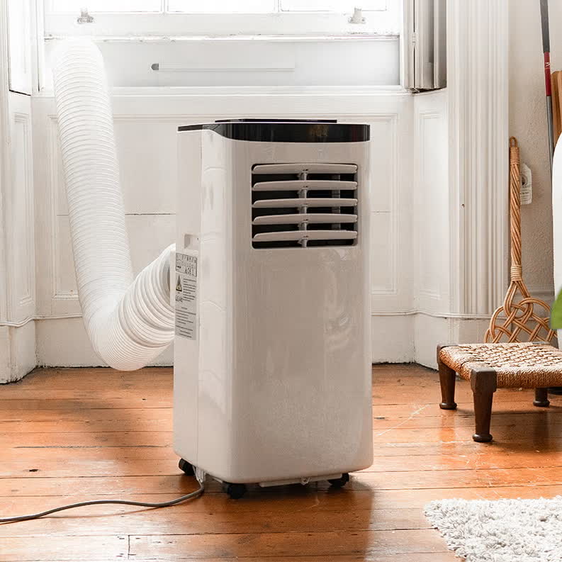 9000 BTU portable air conditioner to rent in Lisbon — standing unit with wheels, remote and digital display